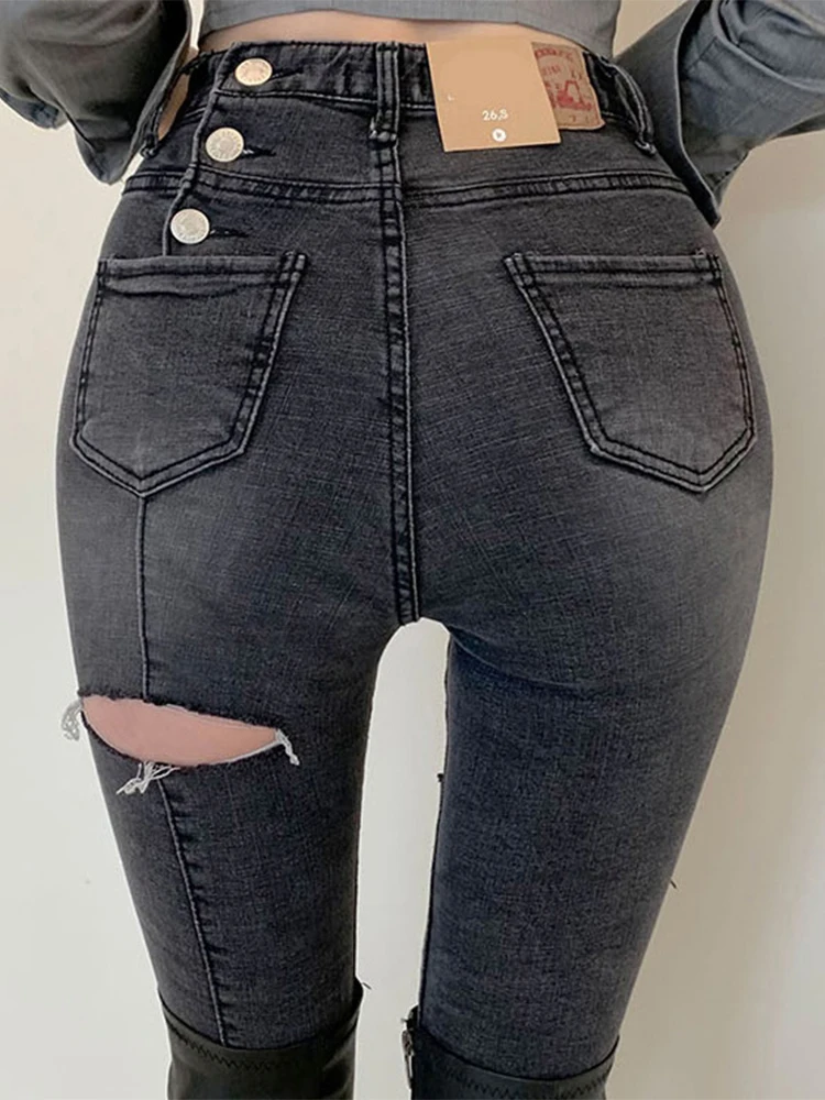 

Fashion Korean style ripped high waist jeans women's 2021 autumn and winter hot sale buttoned harem pants Tight trousers