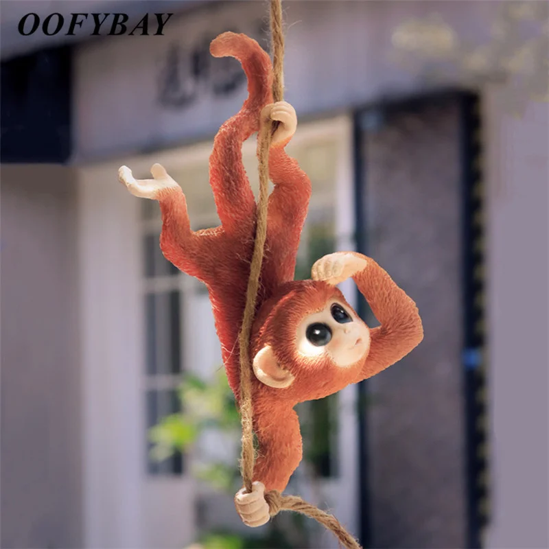 

Cute Resin Cartoon Rabbit Sitting on Swing Sculpture Courtyard Monkey Figurine Garden Animal Statue Home Decoration Ornaments