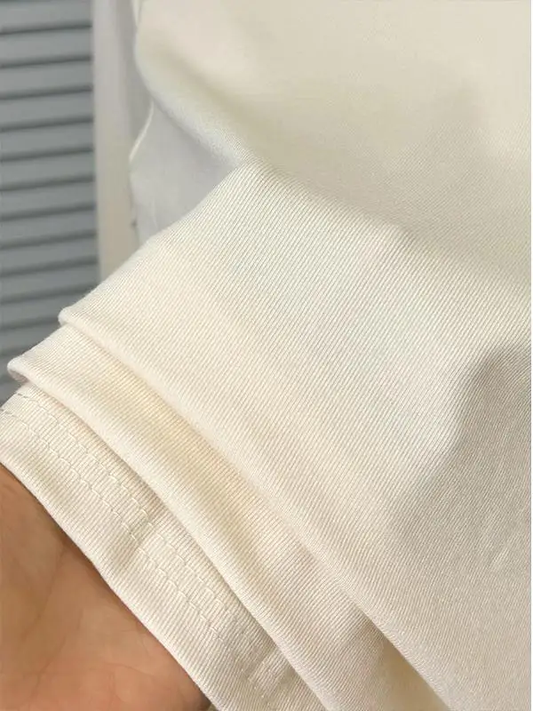 Нижняя рубашка абрикосового цвета с полувысоким воротником и длинными рукавами