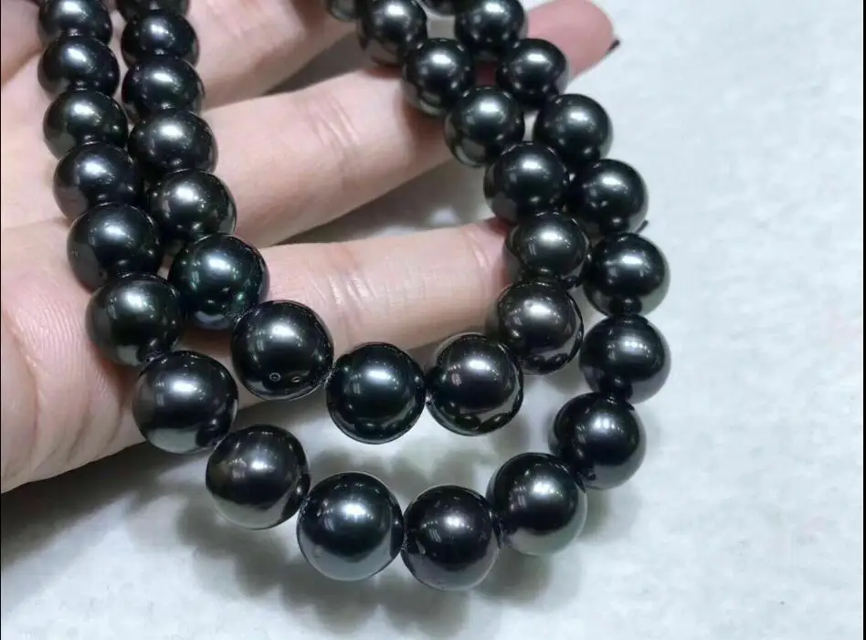 

AAAAA LUSTER 10-11mm REAL natural South Sea black pearl necklace 35“Clasp