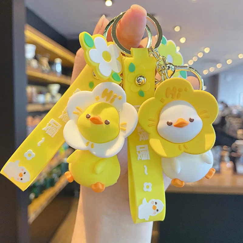 

Creative cartoon fun flower duck turn key chain cute pet three-dimensional duck doll car pendant bag accessories small gift