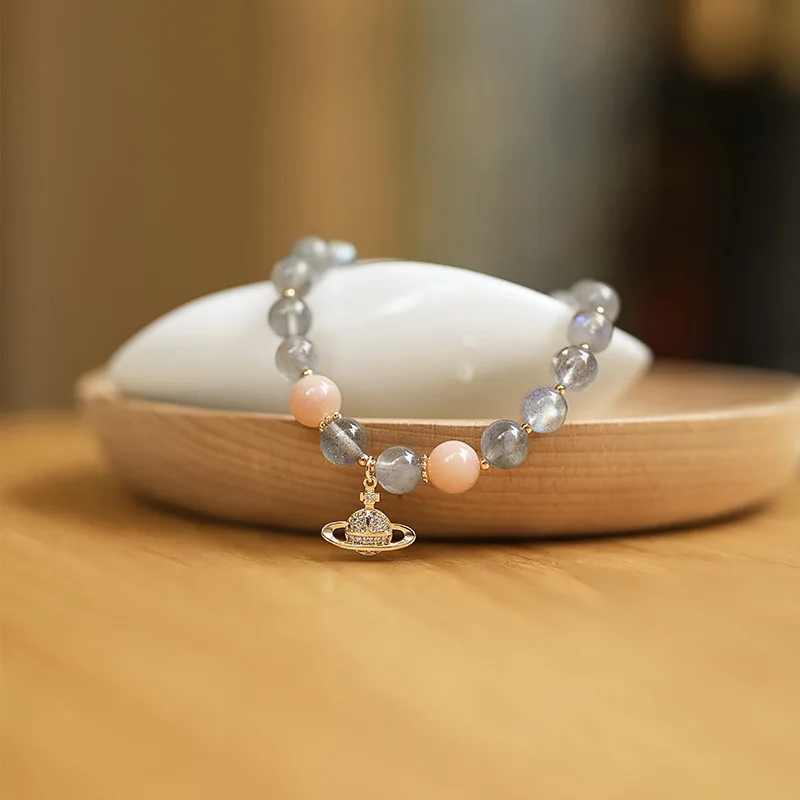 

Браслет с бусинами и кристаллами в виде планеты