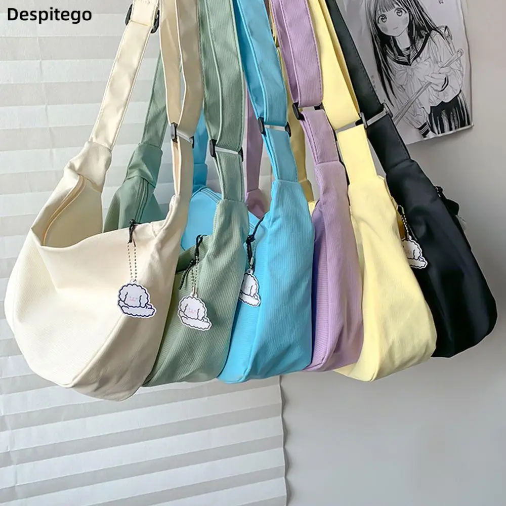 

Korean Style Canvas Bag Large Capacity Cream Color Crossbody Bag with Pendant Student Lightweight Shoulder Bag