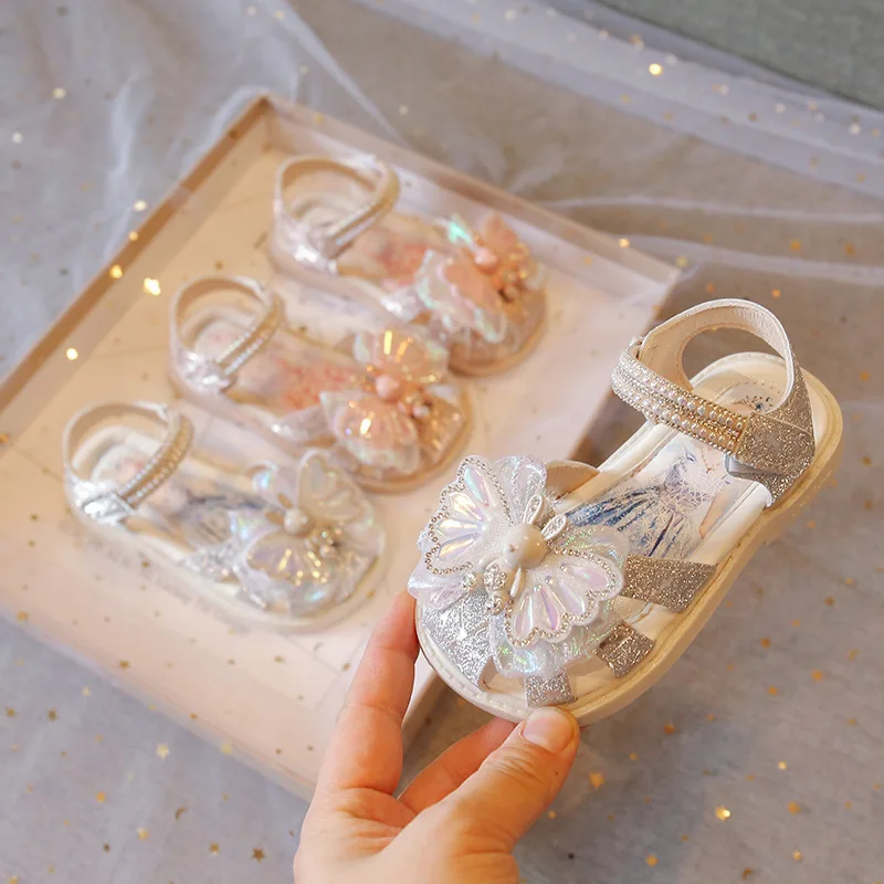 

Girls' Baotou Hollow Sandals 2023 Summer New Little, Medium, And Big Children'S Angel Rabbit Water Diamond Shiny Princess Shoes