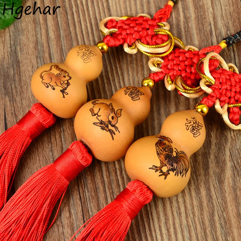 

Подвеска в виде тыквы с китайским знаком зодиака