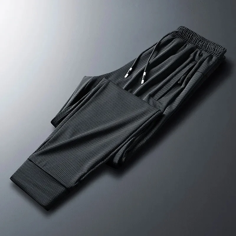 

Men's Summer Ice Silk Casual Pants Thin Section Needle-eye Breathable Air-conditioning Sports Binding Feet Cold