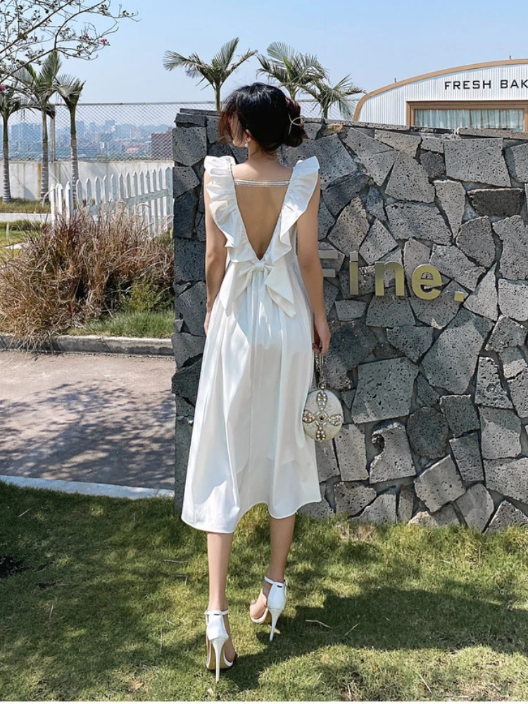 

New Summer Women's Dress Fashion Personality Suspenders Fungus Ruffled Bow Temperament Commuter Sexy Backless Ladies Beach Dress