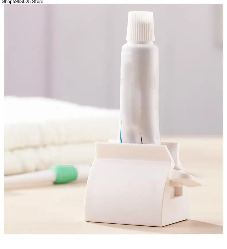 

Multifunctional Bathroom Plastic Cream Tube Squeezing Dispenser Rolling Tube Squeezer Tooth Paste Squeezer Toothpaste Dispenser
