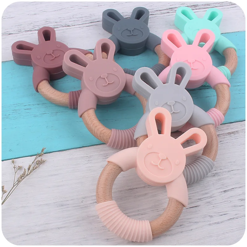 

7Colors Baby Toys Food Grade Silicone Teether Baby Teether Beech Wooden Rabbit Ring Hand Teething Rattles Infant Teether