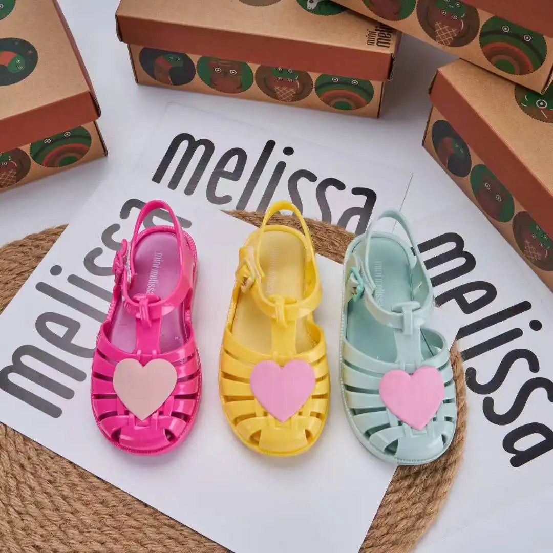 

2023 MINI Melissa Kids' Shoes Children's Wrapped Head Hollow Heart Roman Sandals Flat Heel Sandals Girls' Beach Shoes HMI135