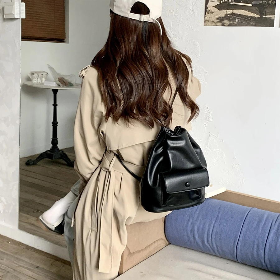 

Korean women's backpack fashion design drawstring Soild shoulder bags simple soft leather bucket bag summer travel schoolbag sac