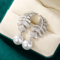 huitan unique design cz feather dangle earrings with round imitation pearl luxury bride wedding earring trendy jewelry for women