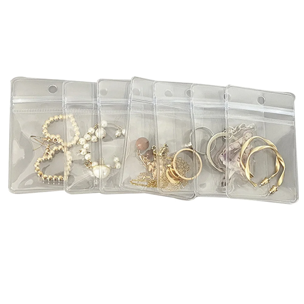 

100Pcs 25 Wires PVC Clear Perforated Thickened Storage Gift Jewelry Packaging Decoration Bag (7.5X11cm)