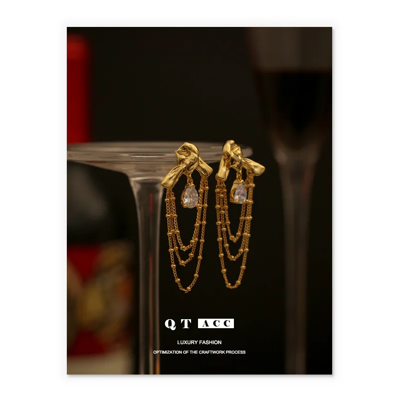 

Brass plated 18K real gold fashion lady style light luxury knot shape water drop shaped zircon tassel earrings earrings female
