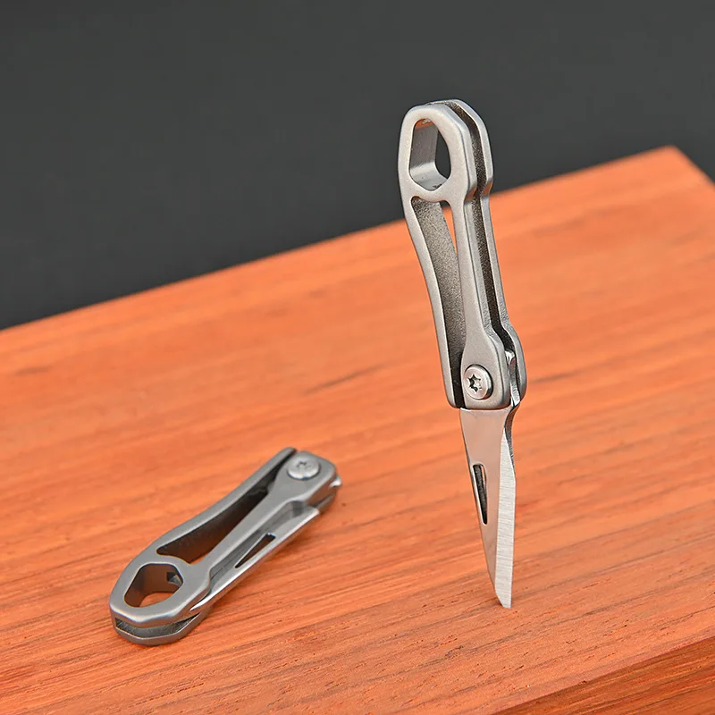 

Mini Blade Fold Key Ring Portable Tool Outdoor Camp Knife Keychain Peeler Open Survive Kit Gadget Package Box Opener Hike Pocket