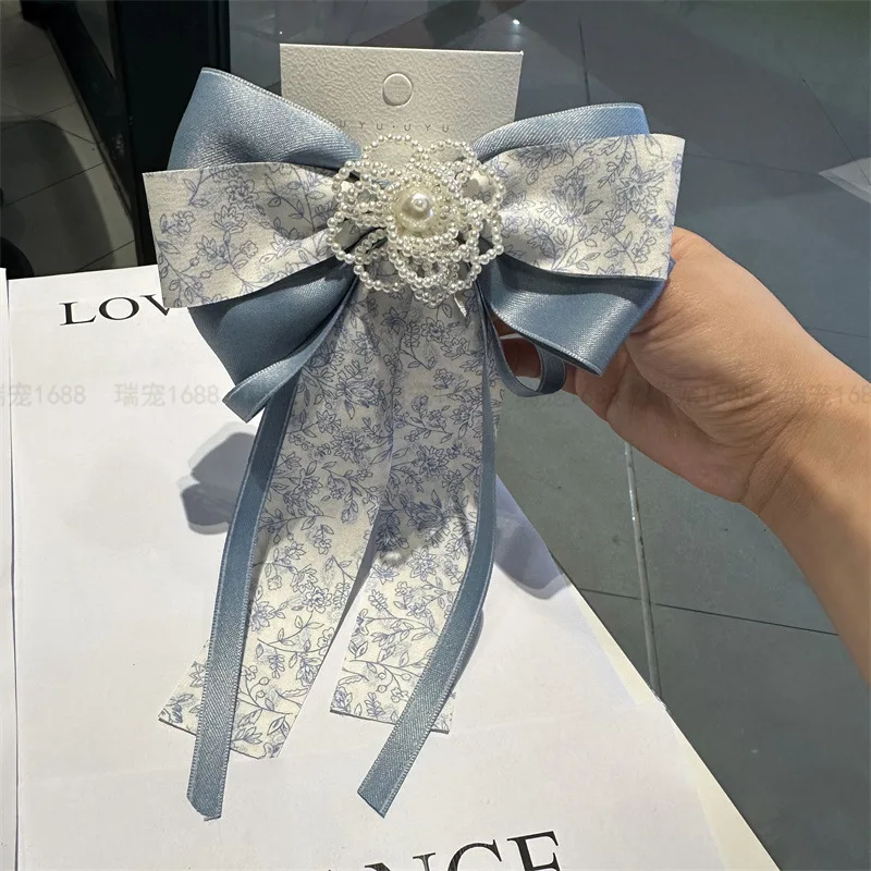 

New Korean Version Sweet Elegant Ribbon Pearl's Hill Camellia Hairpin Bow Spring Clip Women's Top Clip Hairpin Hair Accessories