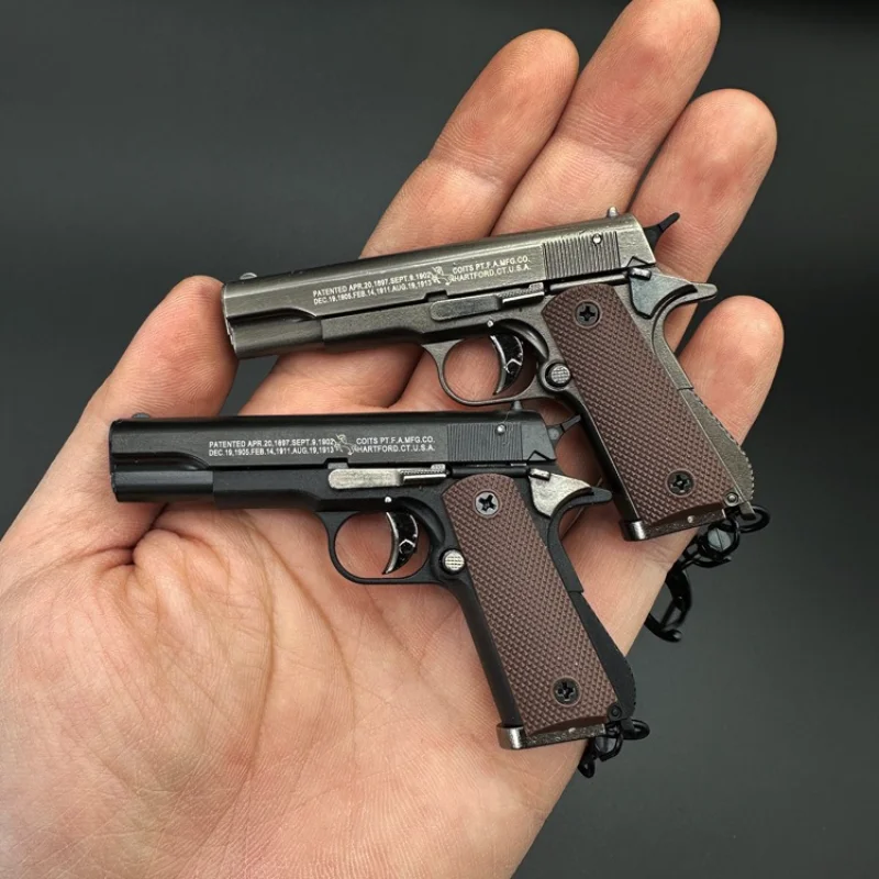 Фото Новая модель пистолета 1:3 Colt 1911, брелок для пистолета, съемный чехол из сплава, игрушки, украшения, ремесла, фигурки и миниатюры №5