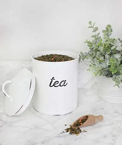 

Elegant Vintage-Inspired Distressed White Enamelware Canister - Perfect Rustic Style Tea Storage for Your Kitchen.