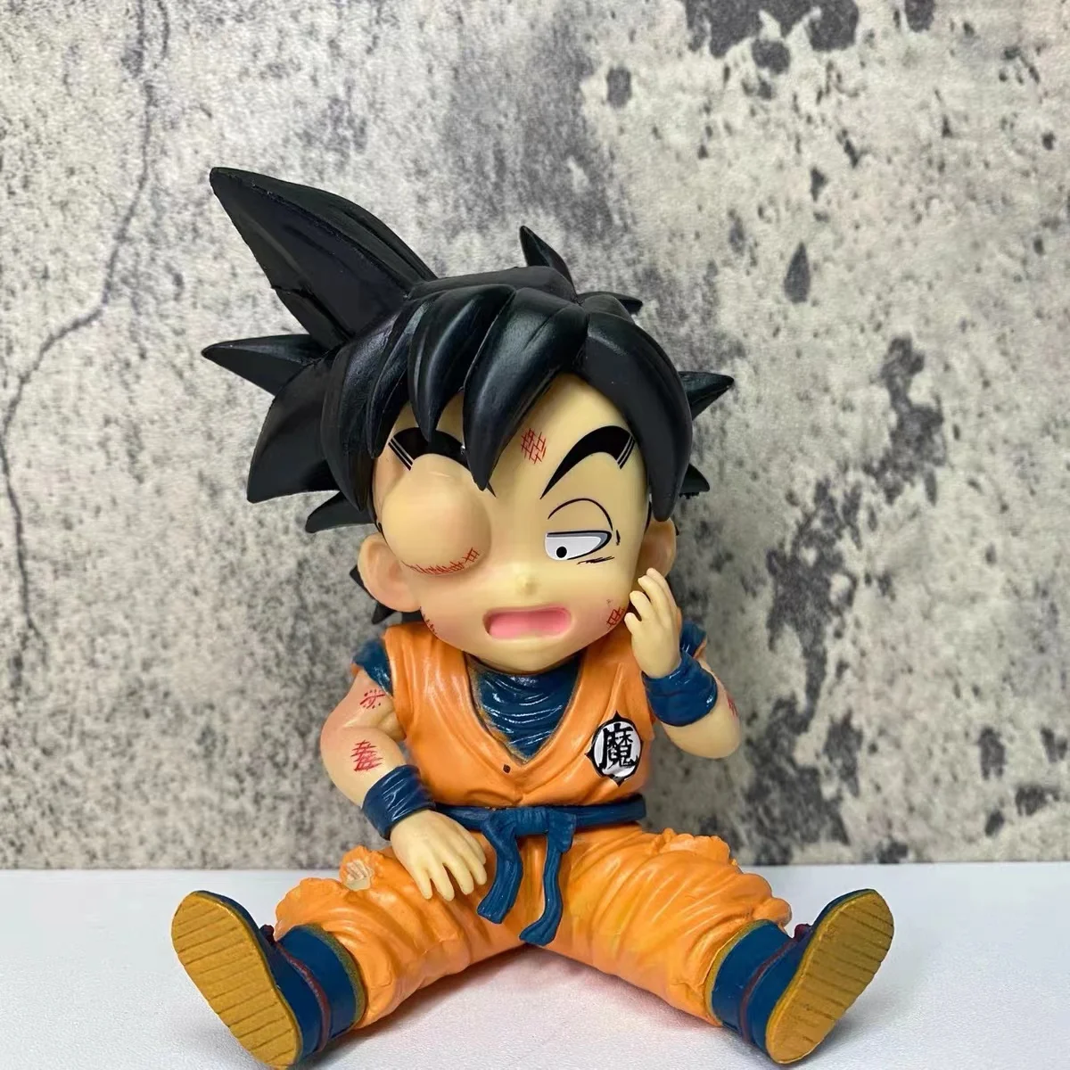 

2023New 11CM Anime Dragon Ball Q Version Sitting Swollen eyes one-eyed Goku Figurine PVC Model Doll Collection Toy Kids Gift