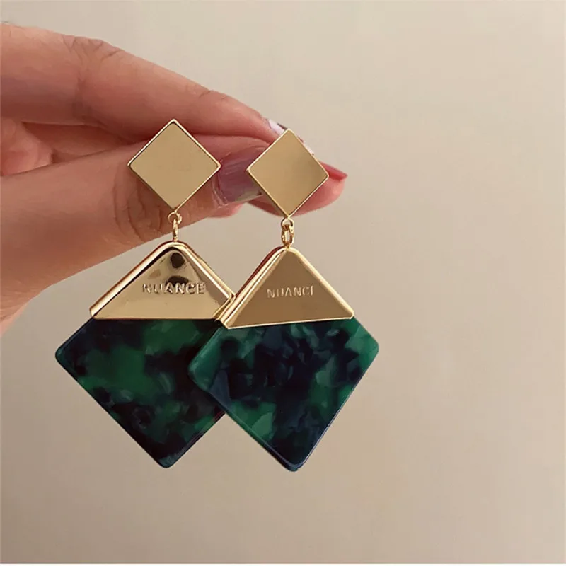 

Korean version of atmospheric geometric green earrings personality senior sense exaggerated retro studs new earrings