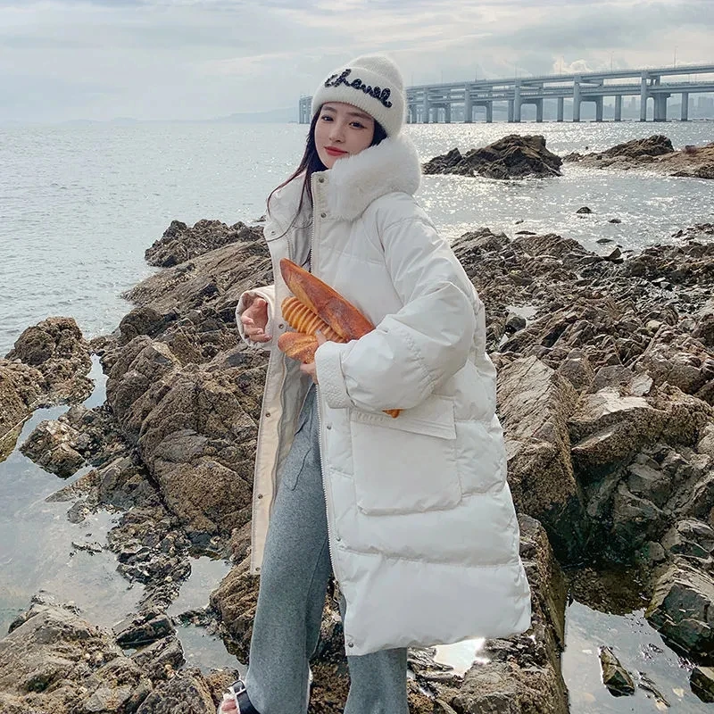 Женская длинная стеганая куртка с меховым воротником и капюшоном теплая зимняя