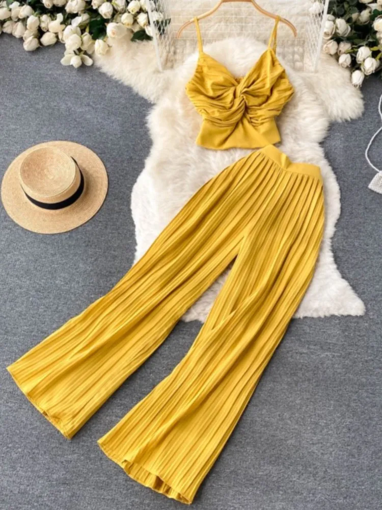 

Летний Пляжный женский брючный костюм, пикантный короткий топ на бретелях, плиссированные брюки с широкими штанинами, Женский Повседневный костюм из двух предметов, новинка