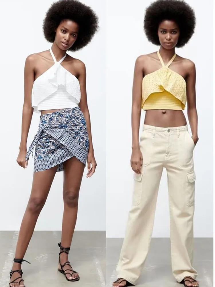 

Женский трикотажный топ с цветочной вышивкой и лямкой на шее