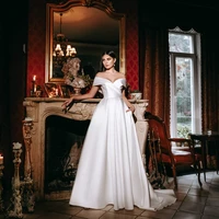 elegant white wedding dress satin off the shoulder dignified brush train pocket empire floor length bride gown customizable