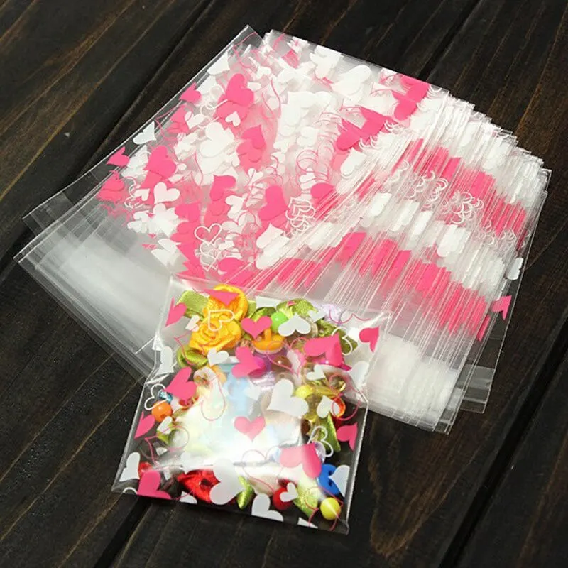 

100PCS Self-adhesive Christmas Food Baking Gift Packaging Bags Stationery Holder Cute Heart Transparent Cookies Candies Bag