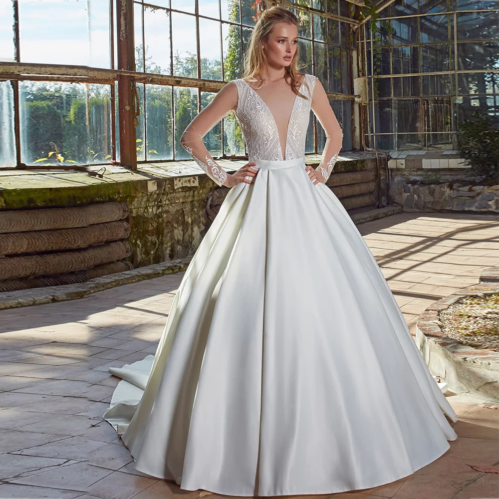 

Princess Modern Wedding Dresses Deep V-Neck Long Sleeves Satin Dress Appliques Lace Backless Chapel Train Ball Bridal Gowns 2022