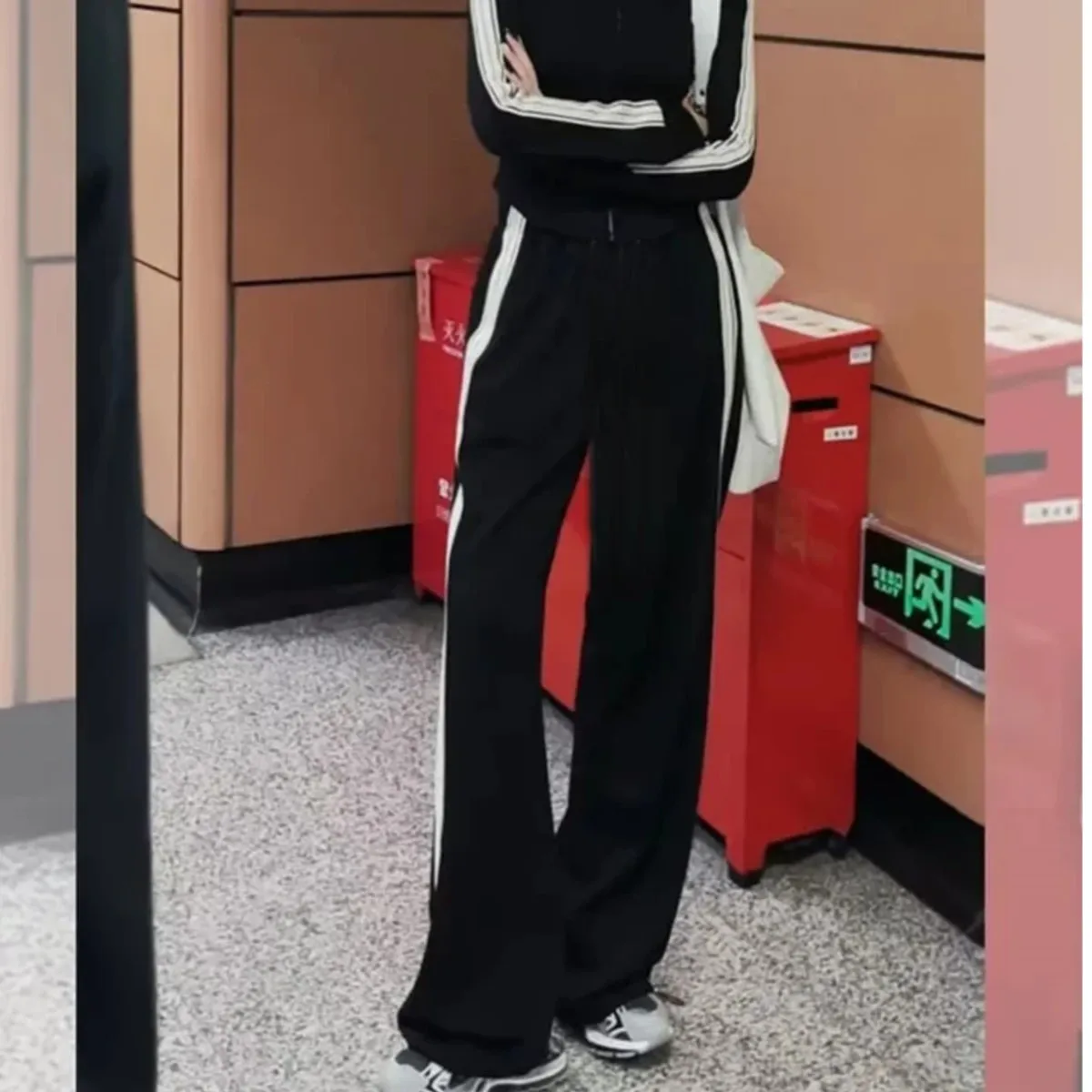 

Women striped black loose fit pant Stripes To Side Relaxed Fit Track Pants