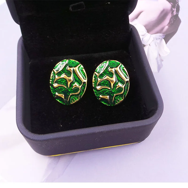 

Серьги-клипсы с зеленой эмалью, 925 игл