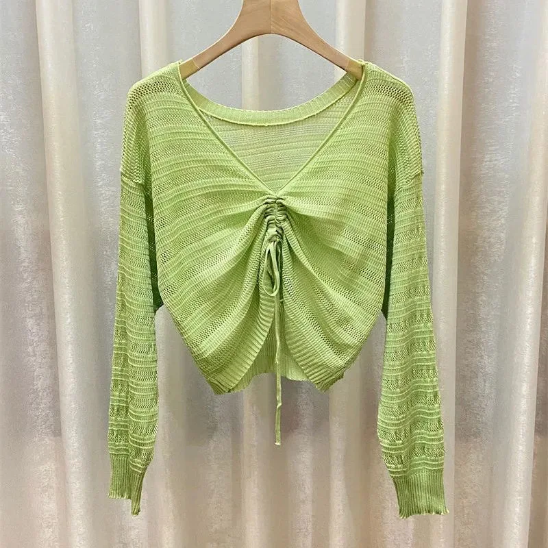 

New Style Hollow thin long-sleeved sunscreen sweater is wearing two loose V-neck drawstring shirt front and back black