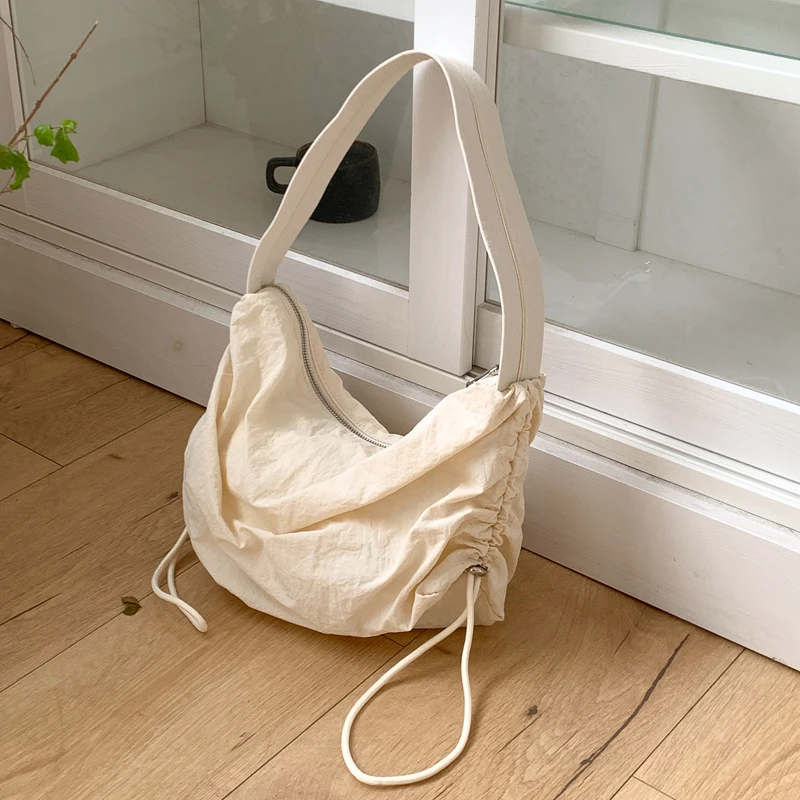 

2022 New Nylon Women's Bag Zipper Drawstring Bag Middle Shoulder Crossbody Bag Japan Plicated Ladies Handbags Whole Sale