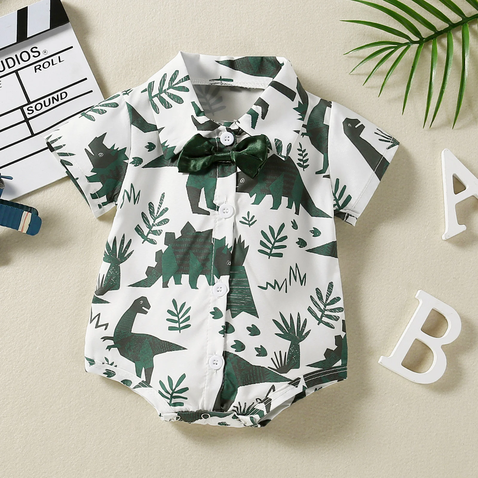 Фото FOCUSNORM 0-24M Gentleman Baby Boys Romper Summer Cartoon Dinosaur Leaves Printing Short Sleeve Single-breasted Jumpsuit |