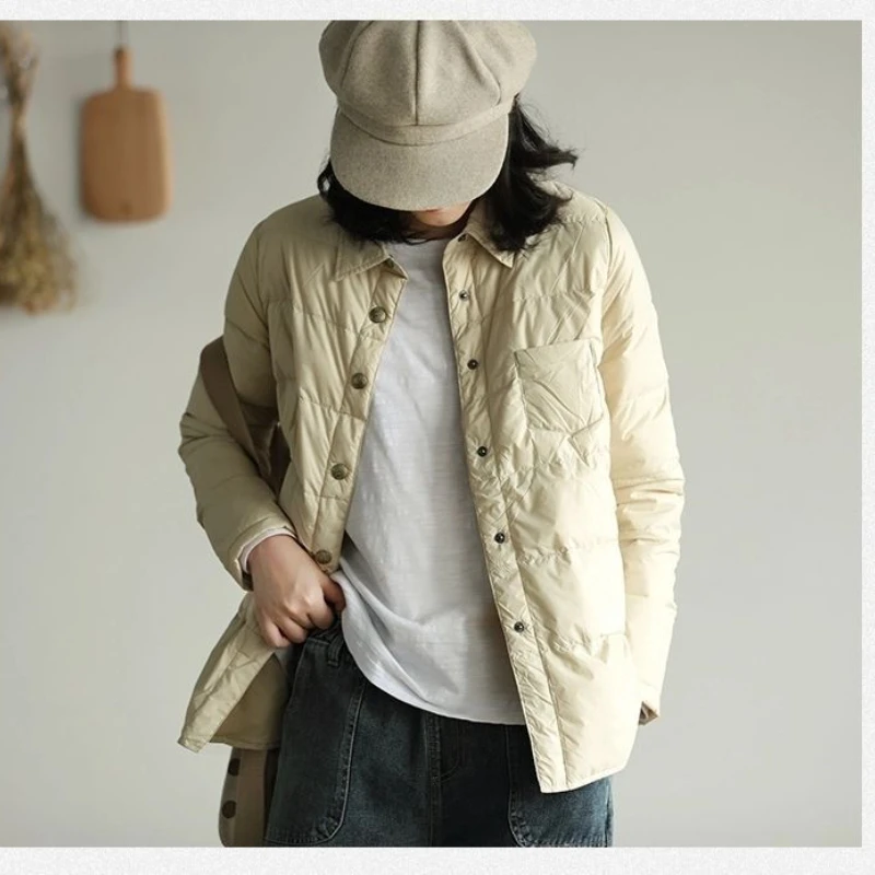 Осенне-зимняя женская куртка с перьями