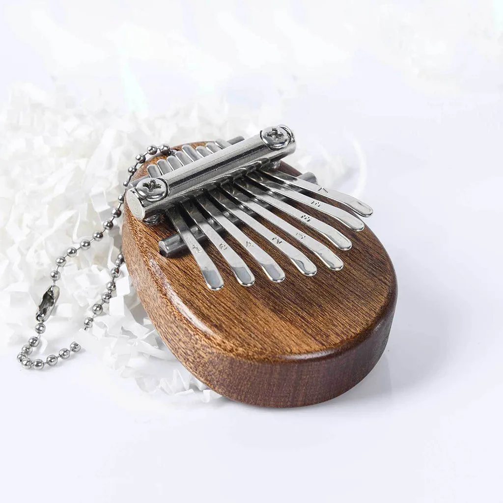 

8 Key Stylophone Mini Kalimba Thumb Piano Finger Piano Portable Marimba Musical Pendant Gift 8 Key Keyboard Musical Instrumen