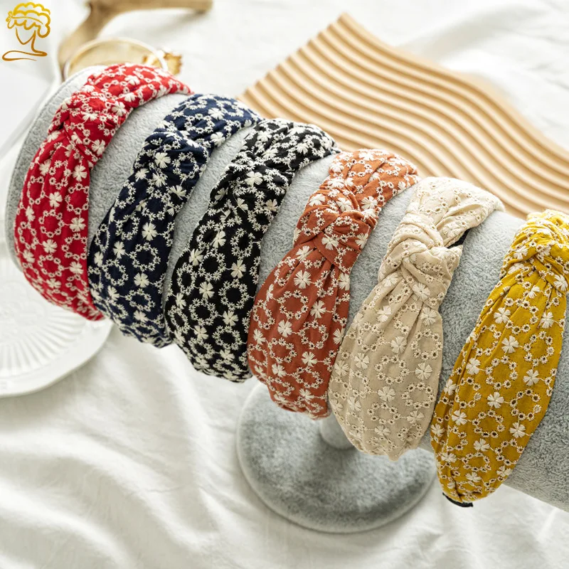 

New hollow fabric wide version crimped cross headband European and beautiful style knotted headband