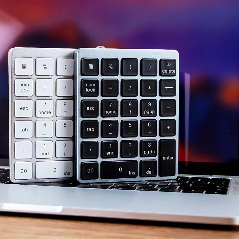

Numeric Keypad 2 Connection Methods Bluetooth-compatible 28 Keys Digital External Keyboard Number Pads