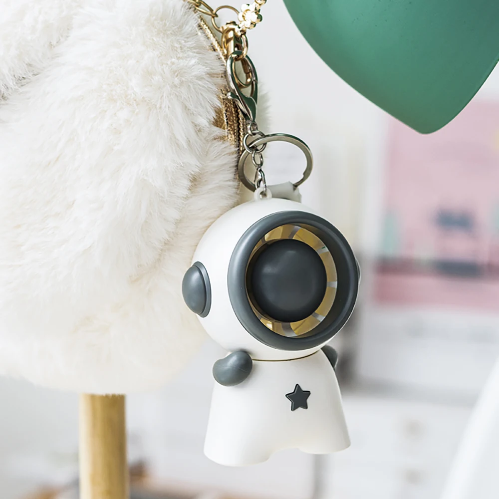 

USB Mini Handheld Fan Creative Long-lasting Life Mute Charging Three Levels Wind Power For Office Desktop Spaceman Shaped Fan