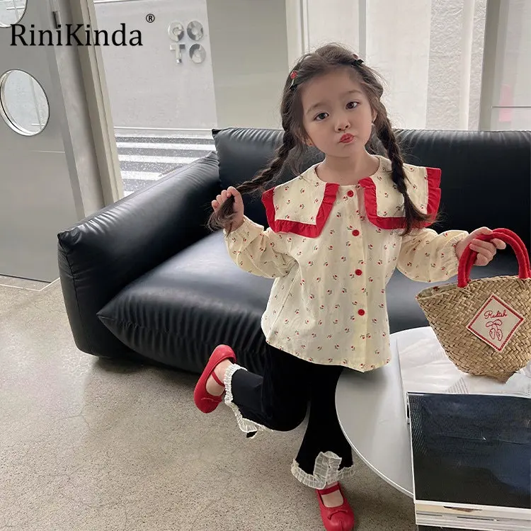 

Детская блузка с рюшами, длинным рукавом и пуговицами