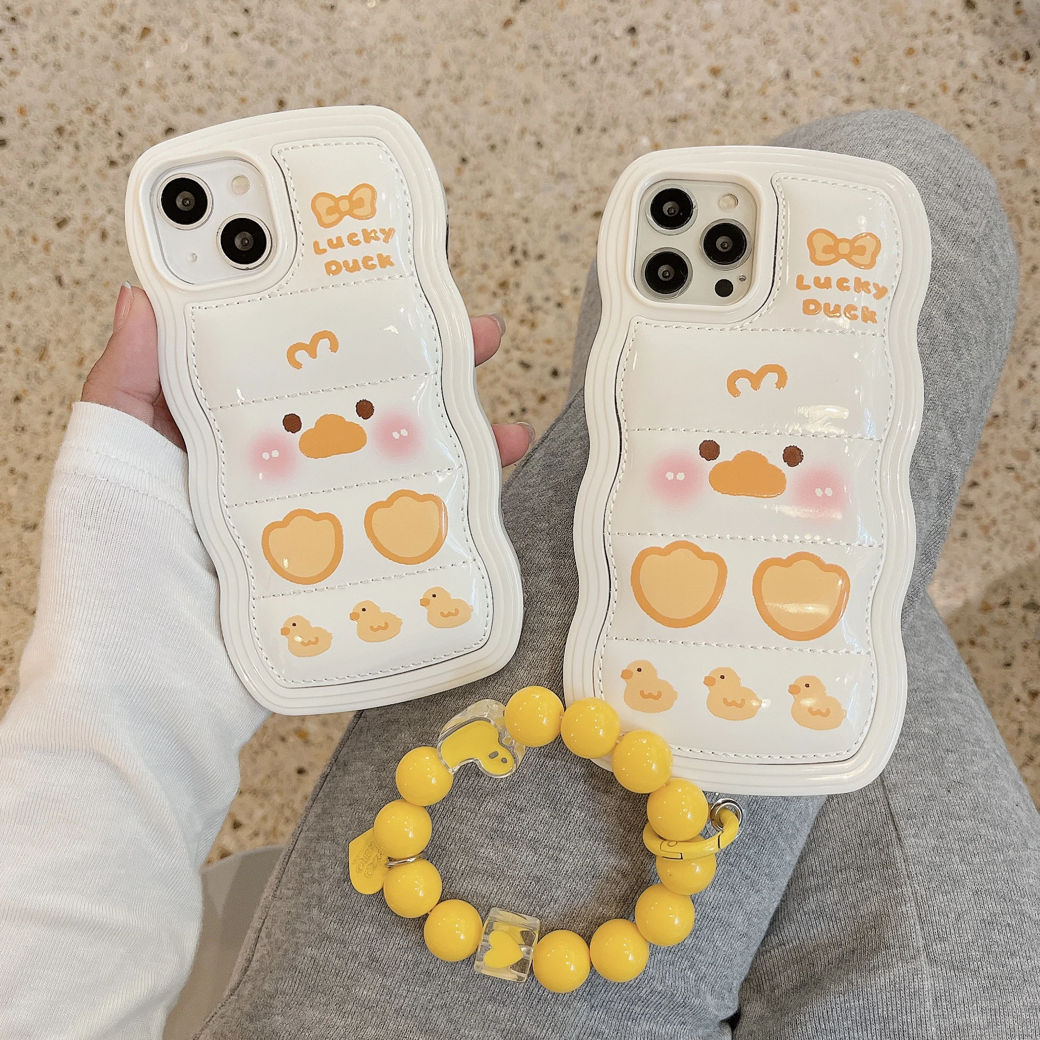 

Fashion Cute Funny Down Air Cushion Cartoon Duck with Bracelet Shockproof Soft Silicone Phone Case for 11 12 13 Pro Max X Xr Xs