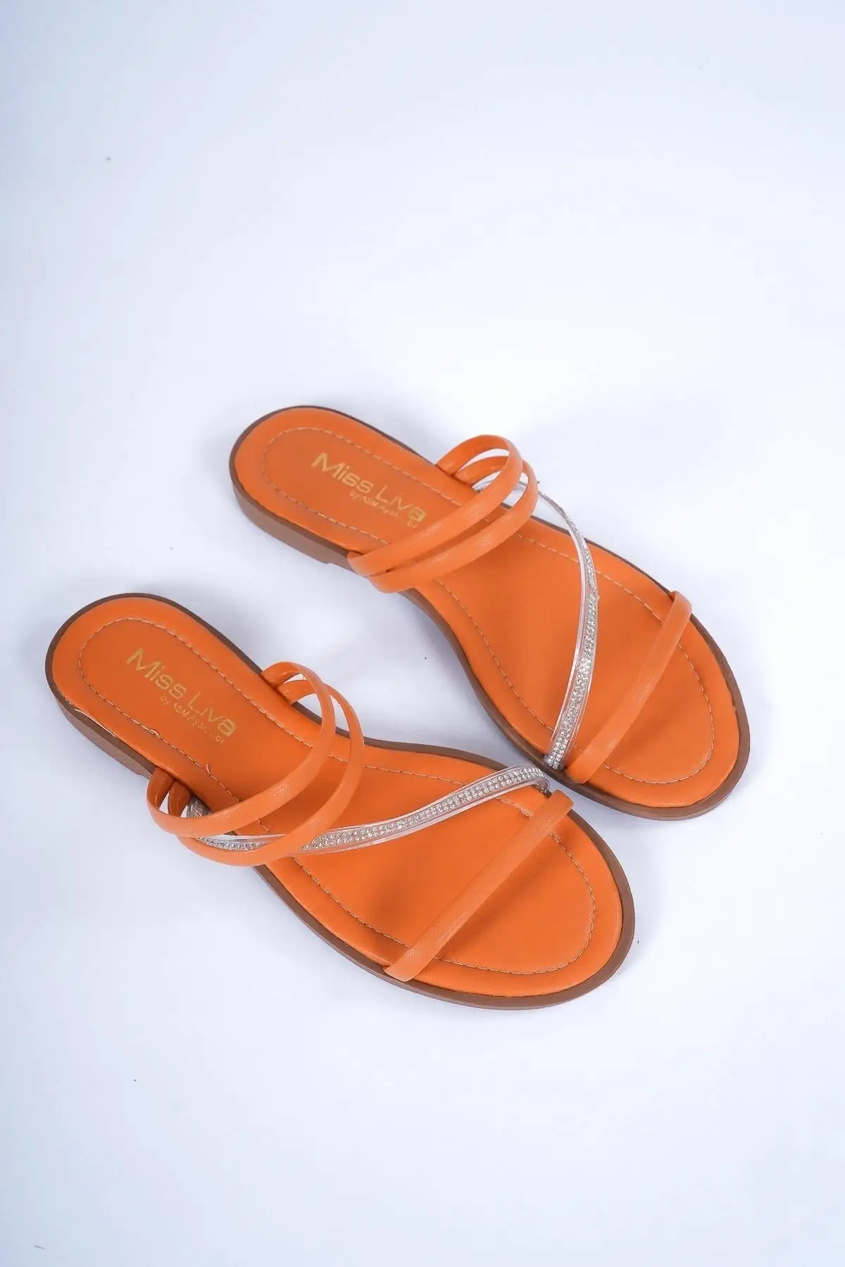 

Orange stone detailed flat slippers