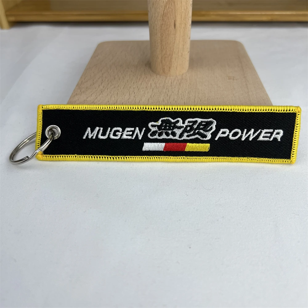 

Car Keychain Fabric Emblem Logo Yellow Line Edging Black Key Ring For Mugen Power Honda XRV 750 650 2023 Rd07 2022 Accessories