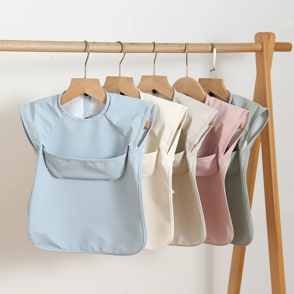 

Nordic Macaron Solid Color Infant Baby PU Bib For Feeding Sleeveless Reverse Dressing Eating Clothes With Pocket Kids Accessory
