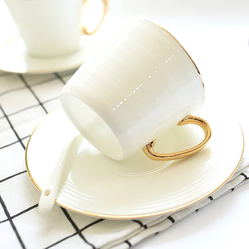 

Белая кофейная чашка и блюдце, дизайнерские фарфоровые кофейные чашки из костяного фарфора, набор керамических кофейных чашек для чая, чашк...