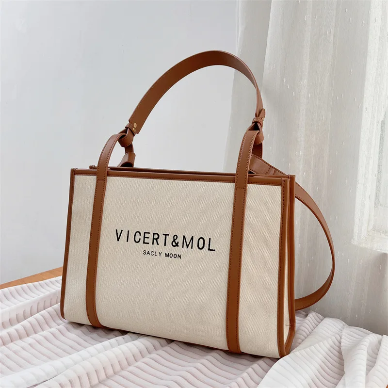 

Large capacity shoulder tote bag niche design letter premium sense leather briefcase commuter tote bag woman