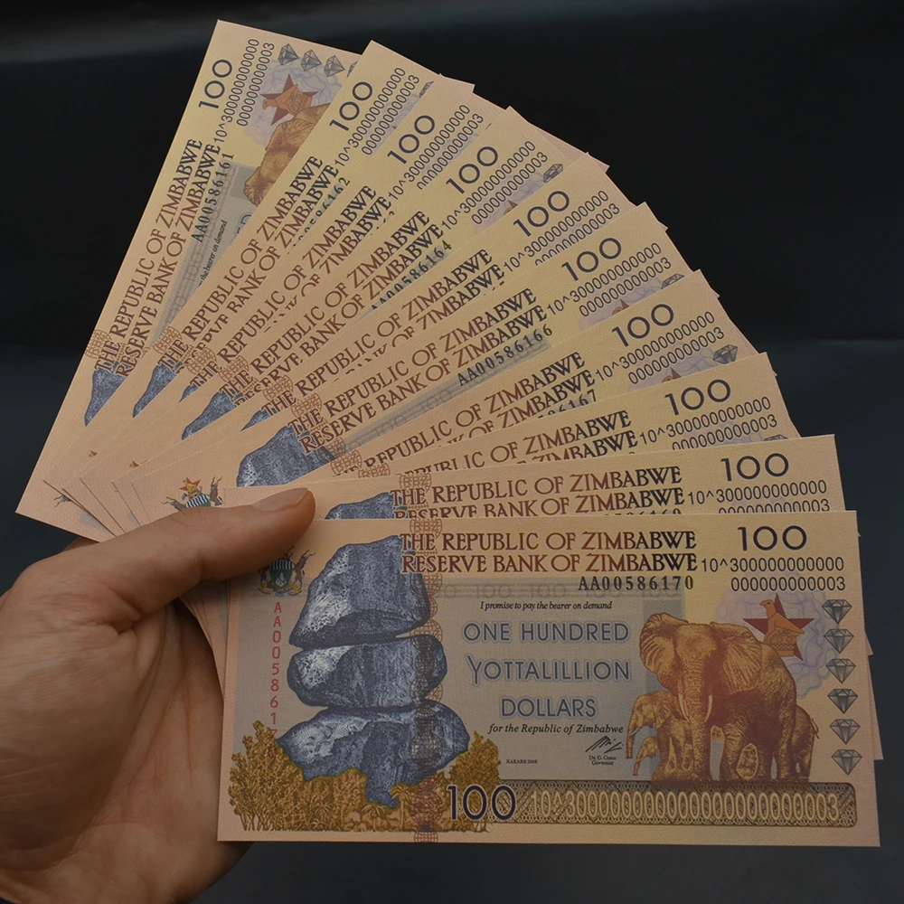

Золотая банкнота Зимбабве 100 йотталлионов долларов со слоном MAI KE