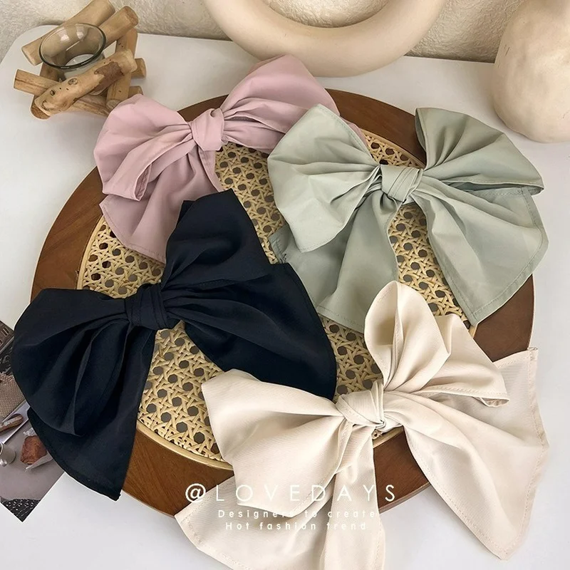 

Korean version of the elegant big bow hairpin back of the head temperament hairpin color fabric clip headdress 2022 new