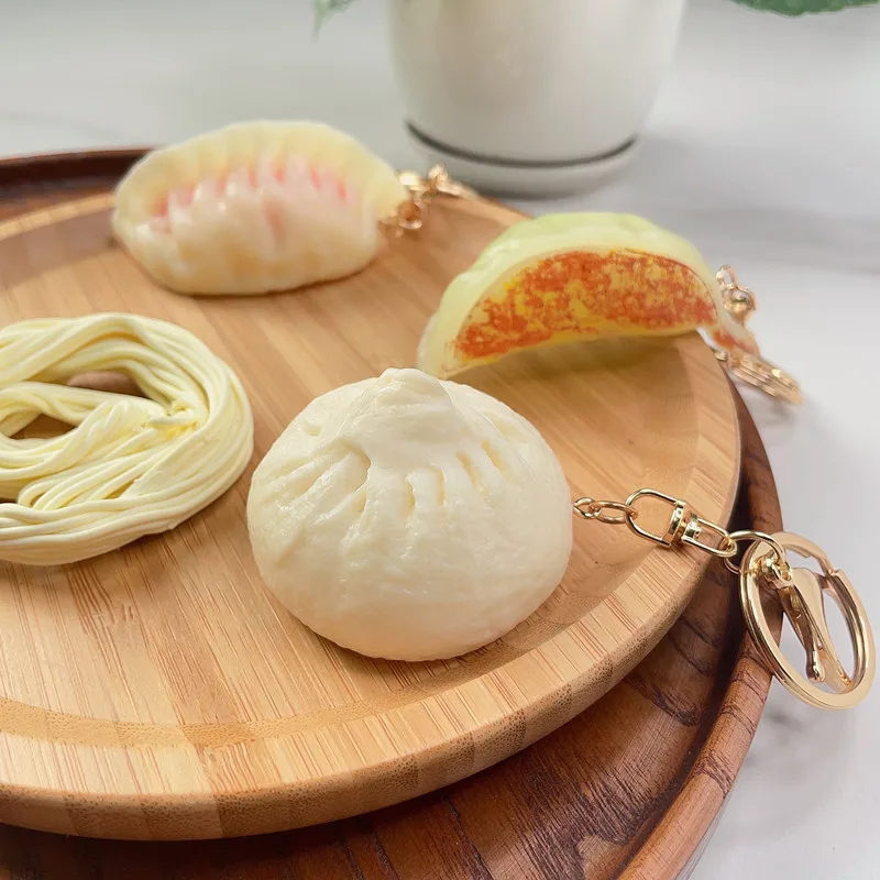

Simulation Food Keychain Dumplings Baozi Noodles PVC Mini Boiled Key Chain Jiaozi Toys Bag Backpack Ornament gift Wholesale